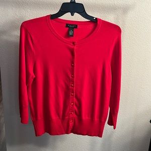 Red button up cardigan sweater.